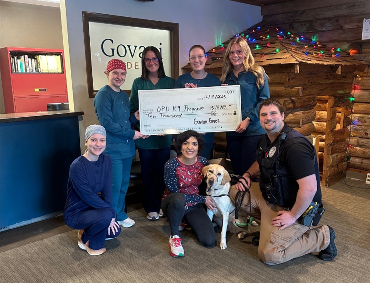 K9 Odin and group receive a donation check