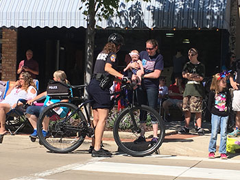 Bike Patrol Officers talking with a family