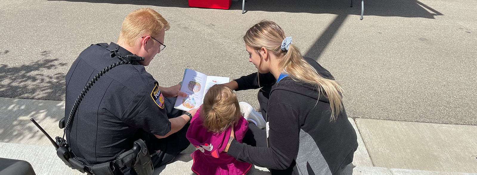Officers high fiving citizens at a community event