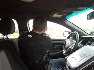 Photo of Officer in squad car